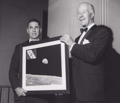 Bill Anders in 1969 being congratulated by the Explorers Club president Walter Wood for a successful mission to the moon 